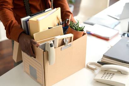 Man packing up his workplace - Employment Law
